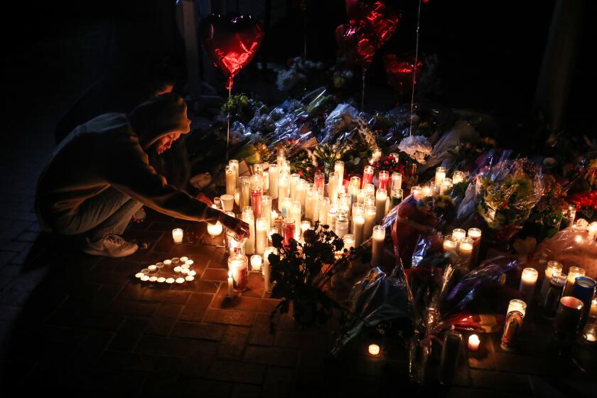 Monterey Park, CA - January 23: Mourners take part in a vigil for the victims of a mass shooting at the Star Dance Studio on Monday, Jan. 23, 2023, in Monterey Park, CA. The investigation into a mass shooting in Monterey Park is focused on the gunman's prior interactions at two dance studios he targeted and whether jealousy over a relationship was the motive, law enforcement sources said.(Allen J. Schaben / Los Angeles Times)