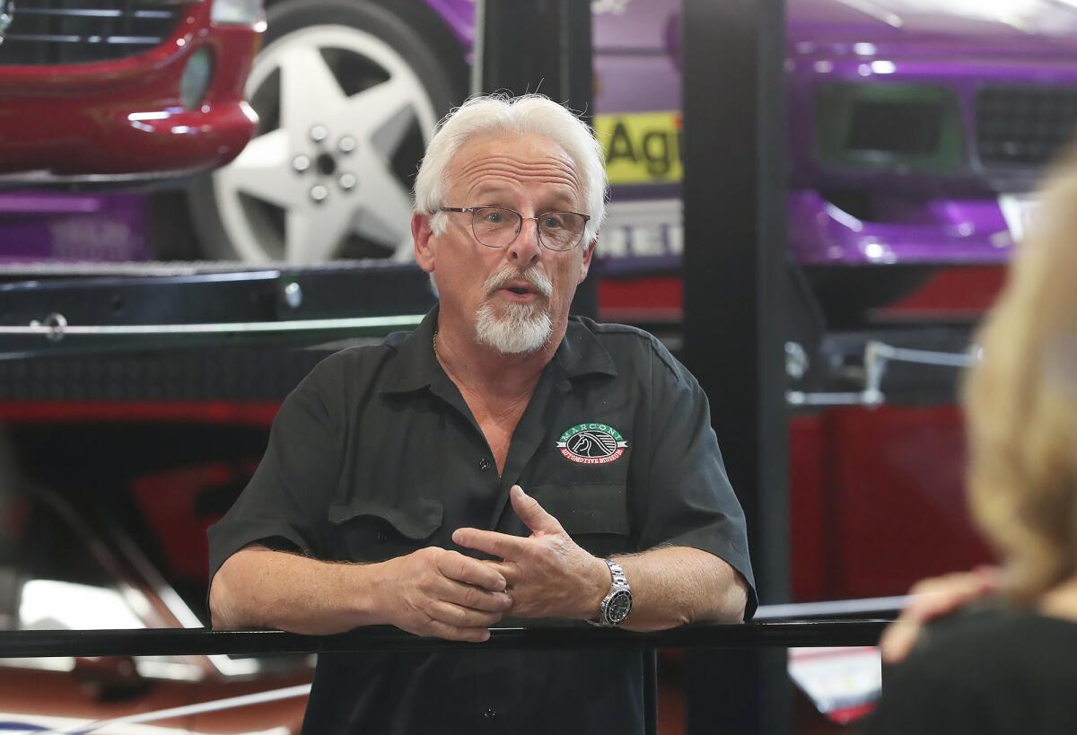 John Marconi speaks during a tour Tuesday at the Marconi Automotive Museum in Tustin. 