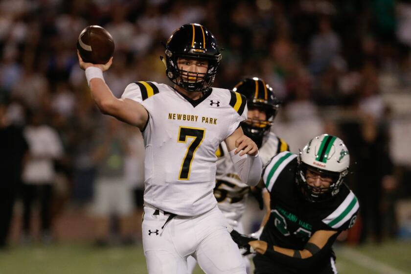 THOUSAND OAKS, CA - SEPTEMBER 23: Newbury Park quarterback Brady Smigiel (7) passes against Thousand Oaks in Friday night's game on Friday, Sept. 23, 2022 in Thousand Oaks, CA. (Jason Armond / Los Angeles Times)