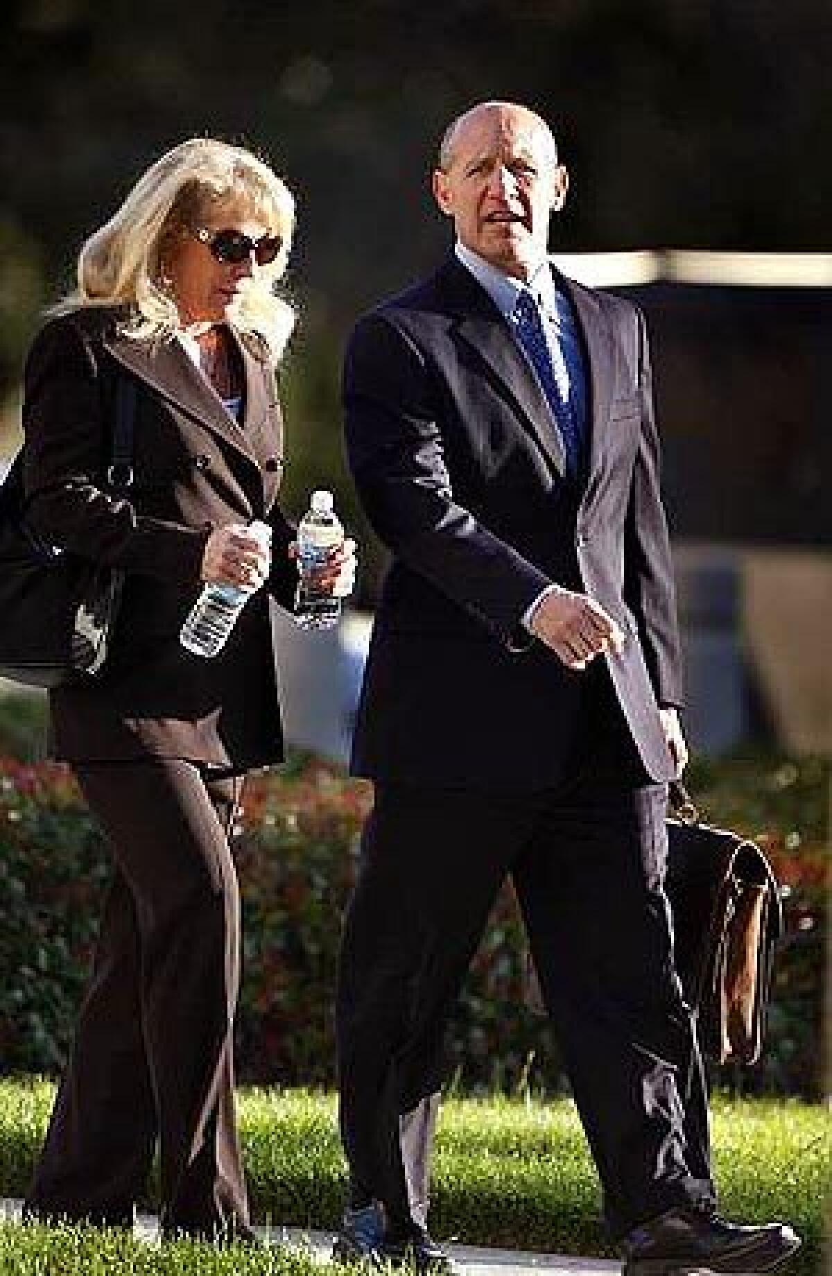Former Orange County Sheriff Michael S. Carona and wife Deborah arrive at the federal courthouse in Santa Ana. A jury is expected to begin deliberations today in the corruption case against Carona.
