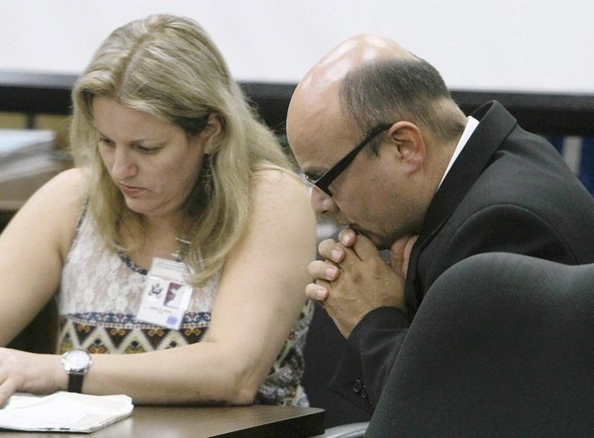 Truck driver Marcos Costa listens to court-appointed interpreter Teresa Krakow during his trial in 2011.