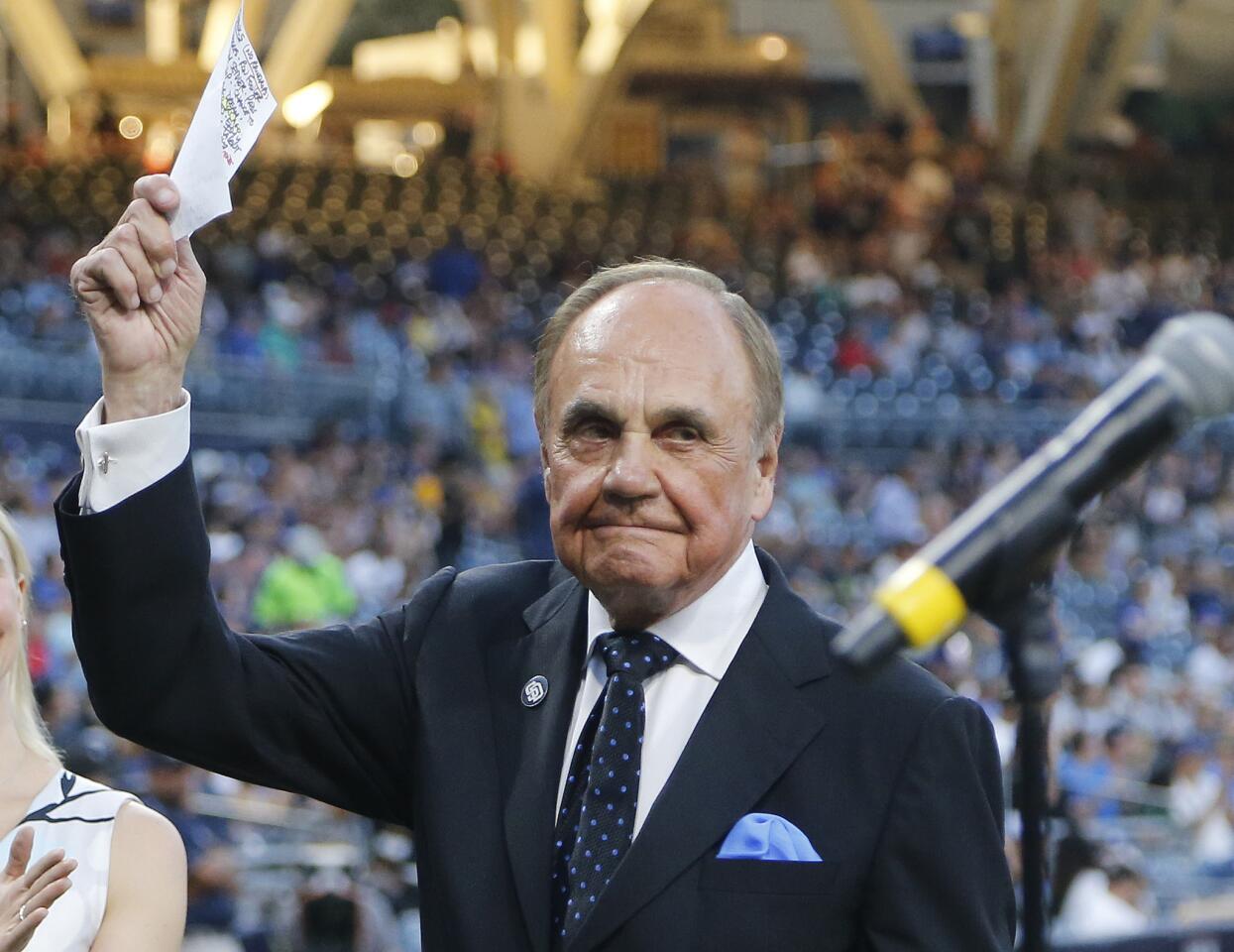 In this Sept. 29, 2016 photo San Diego Padres broadcaster Dick Enberg waves to crowd at a retirement ceremony prior to the Padres' final home baseball game of the season. Enberg died Dec. 21, 2017, at his home in La Jolla, Calif., at age 82. Read more.