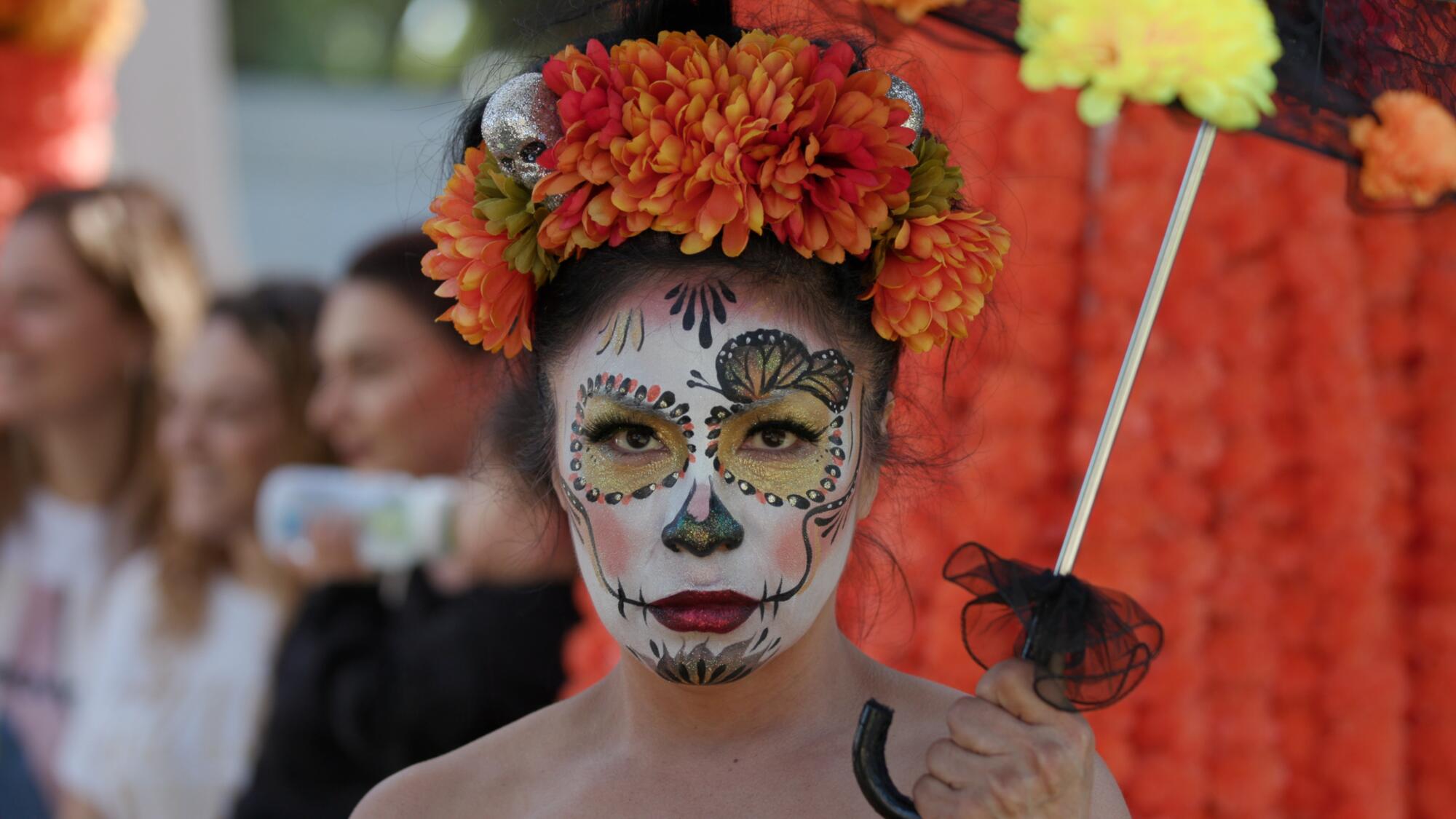A woman attends a Dia de los Muertos event at Hollywood Forever cemetery.