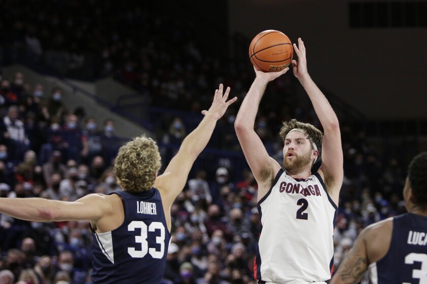 Gonzaga forward Drew Timme (2) shoots over BYU forward Caleb Lohner (33) during the second half of an NCAA college basketball game, Thursday, Jan. 13, 2022, in Spokane, Wash. Gonzaga won 110-84. (AP Photo/Young Kwak)