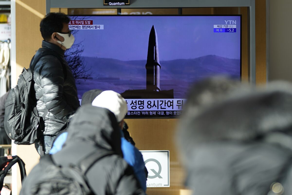People watch a TV screen showing a news program reporting about North Korea's missile launch with a file image, at a train station in Seoul, South Korea, Monday, Jan. 17, 2022. North Korea on Monday fired two suspected ballistic missiles into the sea in its fourth weapons launch this month, South Korea's military said, with the apparent goal of demonstrating its military might amid paused diplomacy with the United States and pandemic border closures. (AP Photo/Lee Jin-man)