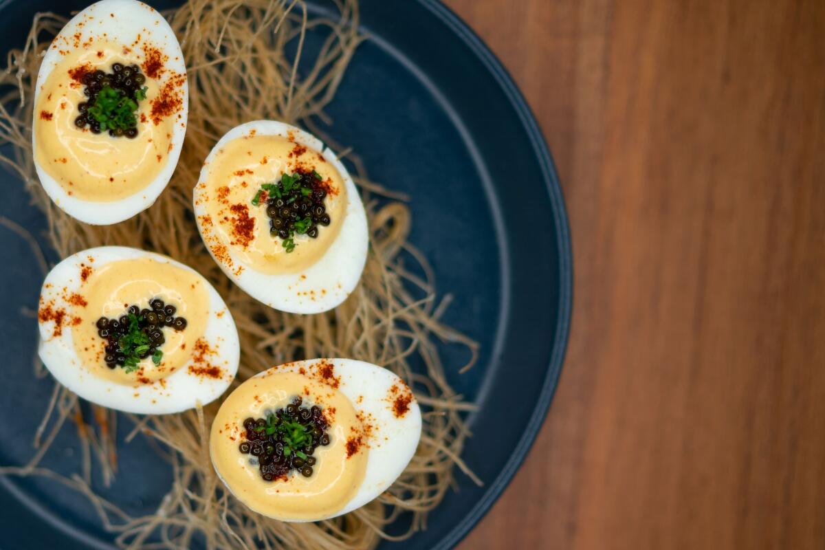 An overhead photo of a plate of caviar-topped deviled eggs from modern bistro Mr. T.