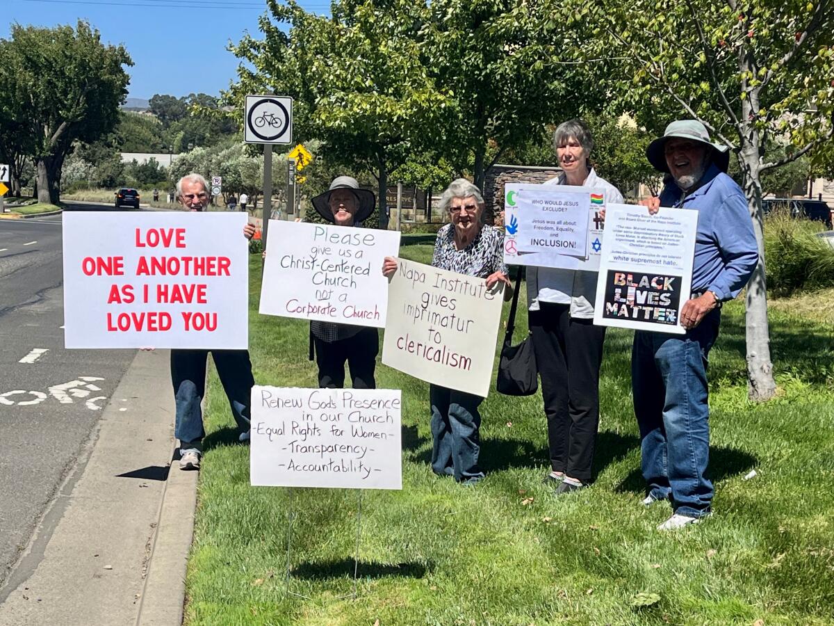 A group protest the Napa Institute’s Summer Conference at the Meritage resort in Napa, Thursday, July 27, 2023. 