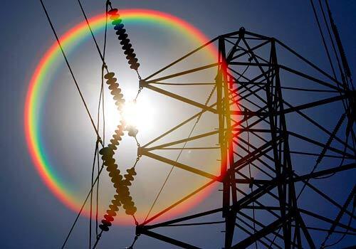 A hot sun shines over power lines Thursday, the third day of a heat wave that's expected to reach its peak over the Labor Day weekend. Residents are urged to avoid outdoor activities from morning through early evening, wear loose-fitting clothes and drink plenty of water to avoid ill effects of the heat, the National Weather Service said.