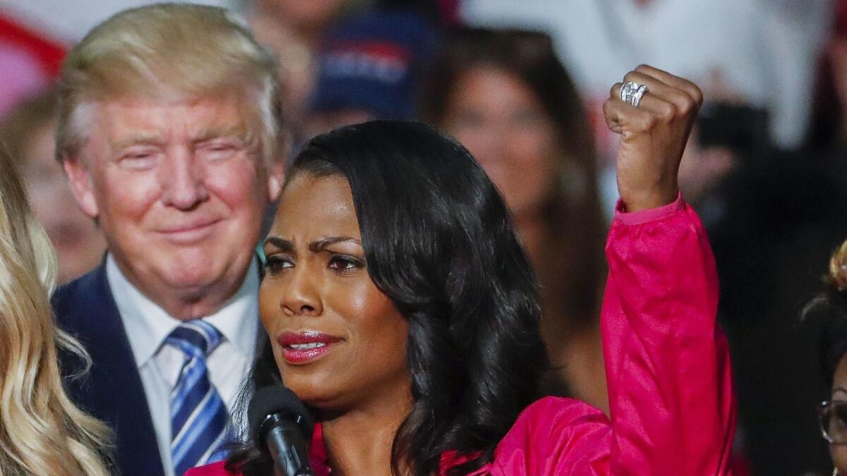 Then-presidential nominee Donald Trump and Omarosa Manigault Newman at a campaign rally with members of the group Women for Trump in Charlotte, N.C., in October 2016.