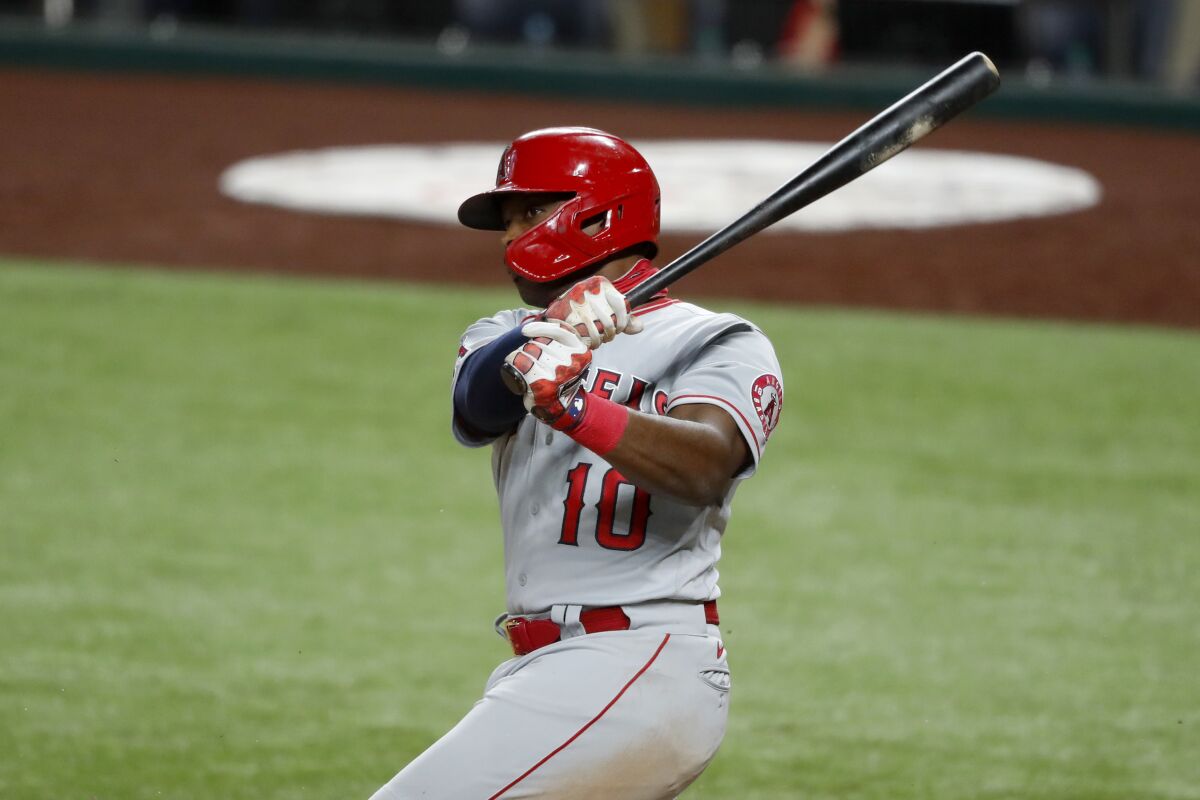 Angels' Justin Upton follows through on a swing against the Texas Rangers.