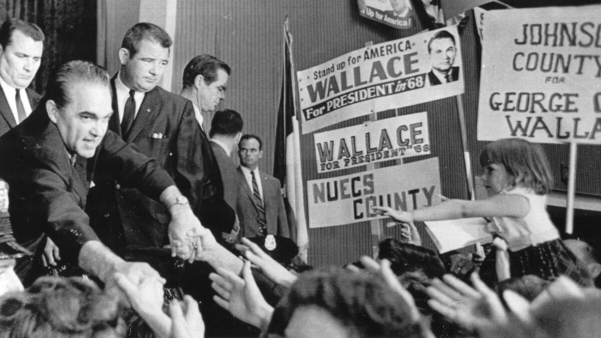 Presidential candidate George Wallace greets supporters at the Texas State convention of his American Independent Party in Dallas on Sept. 17, 1968.