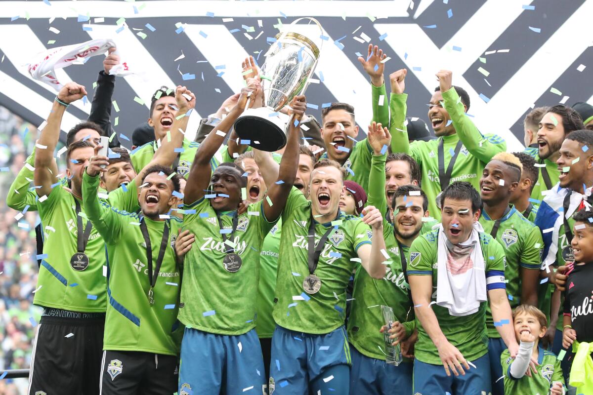 The Seattle Sounders celebrate their MLS Cup victory.