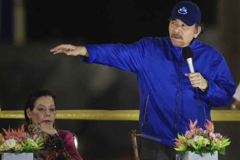 FILE - In this March 21, 2019 file photo, Nicaragua's President Daniel Ortega speaks next to first lady and Vice President Rosario Murillo during the inauguration ceremony of a highway overpass in Managua, Nicaragua. Nicaragua’s National Police have arrested on Tuesday, June 8, 2021, two more potential challengers to President Ortega, the third and fourth opposition pre-candidates for the Nov. 7 elections detained in the past week. (AP Photo/Alfredo Zuniga, File)