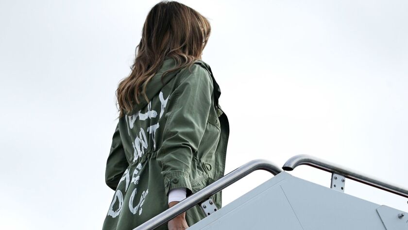 First Lady Melania Trump boards an Air Force plane before traveling to Texas to visit facilities that house and care for children taken from their parents at the U.S.-Mexico border on June 21. On the back of the green jacket is the statement, “I Really Don’t Care, Do U?"