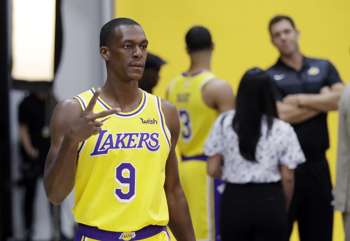 Los Angeles Lakers' Rajon Rondo (9) poses for photos during media day at the NBA basketball team's practice facility Monday, Sept. 24, 2018, in El Segundo, Calif.
