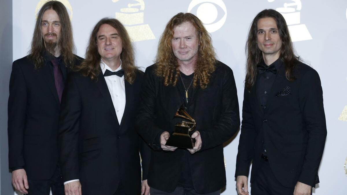 Dave Mustaine, second from right, displaying Megadeth's first Grammy at the 2017 awards ceremony.