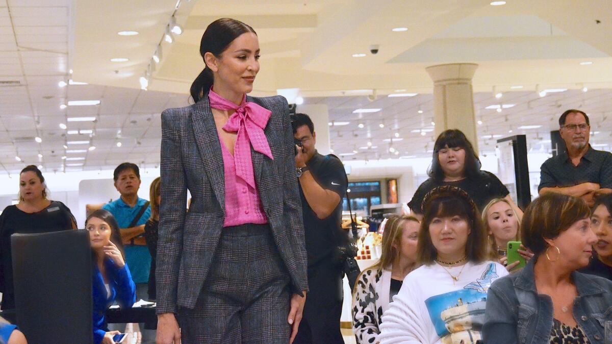 The StyleWeekOC 2019 fashion show highlighted a Veronica Beard checkered suit and pink blouse.