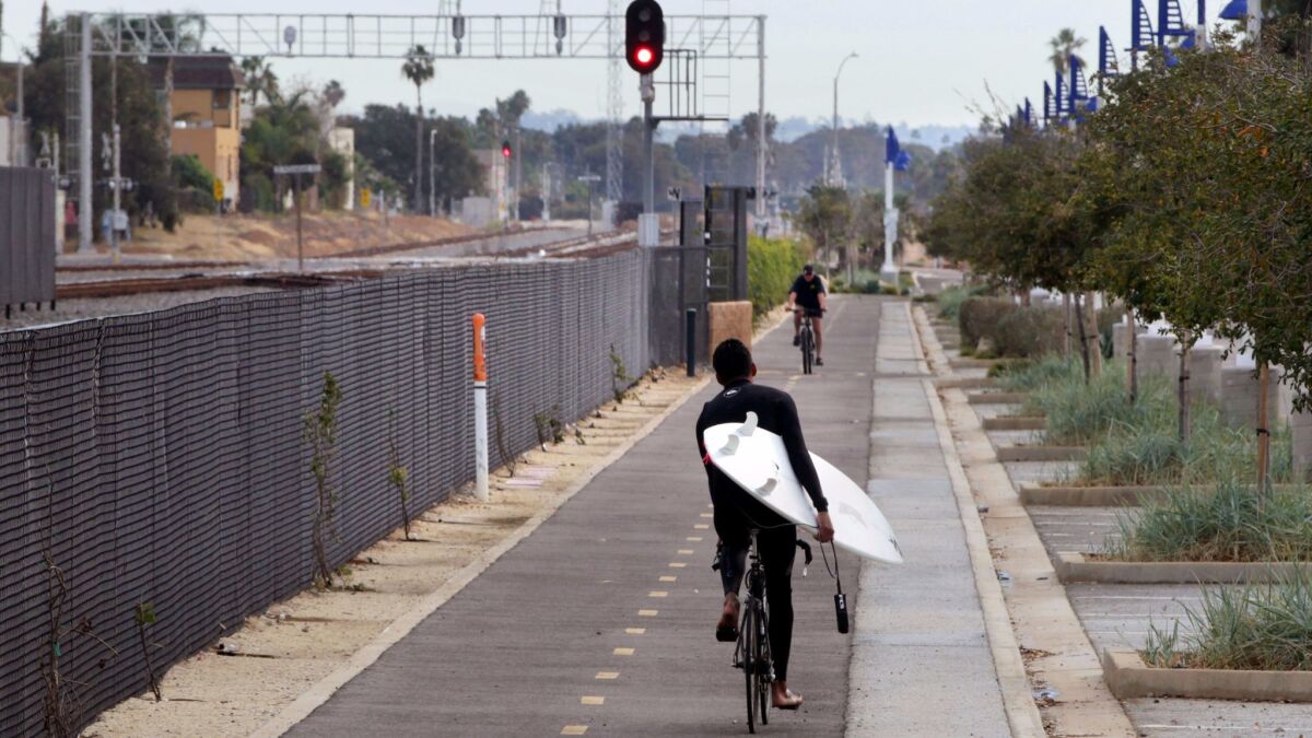 Bike riders travel on the Coastal Rail Trail through Oceanside, south of the Oceanside Transit Center.