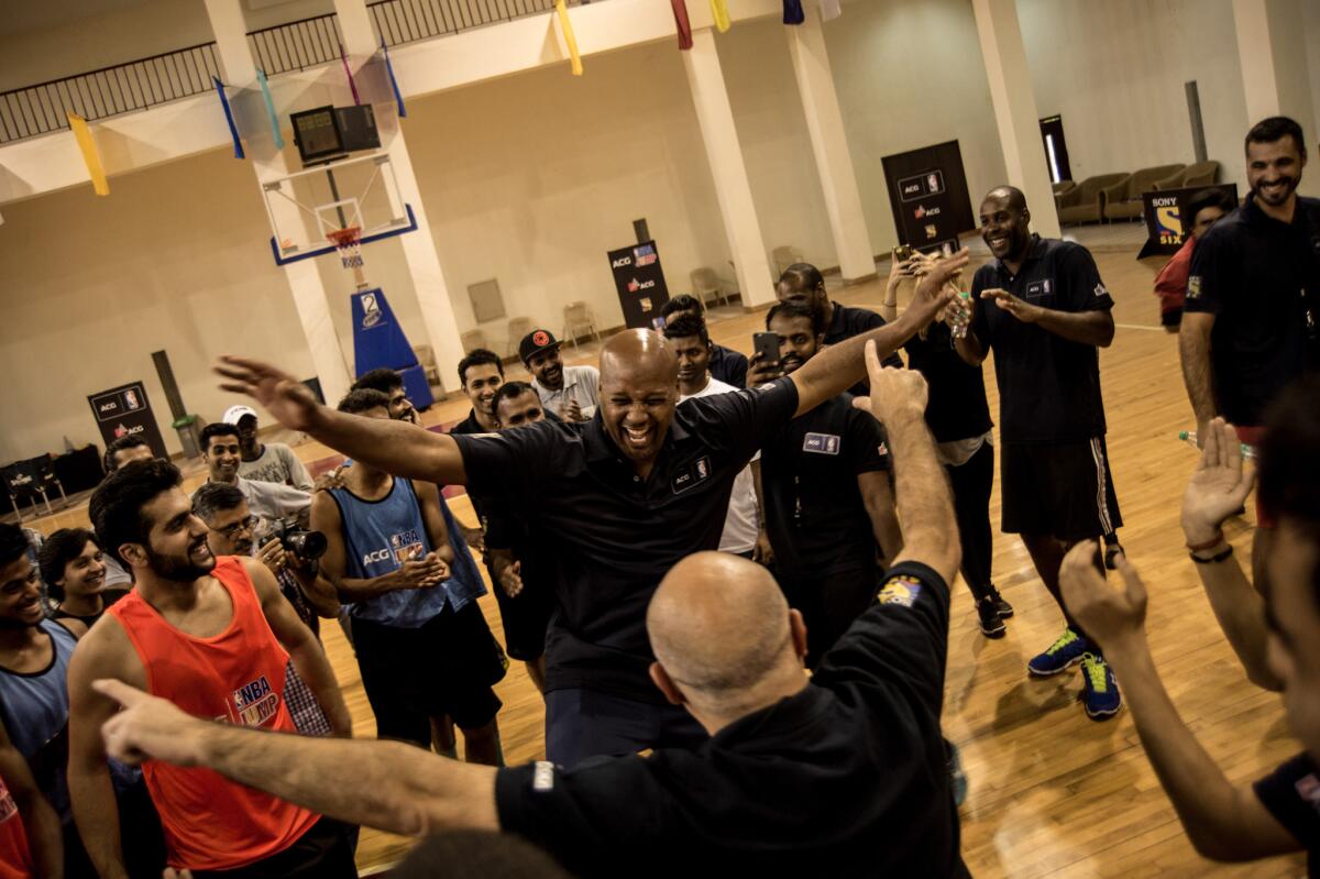 Former Laker Brian Shaw breaks into a dance routine with coaches and players.