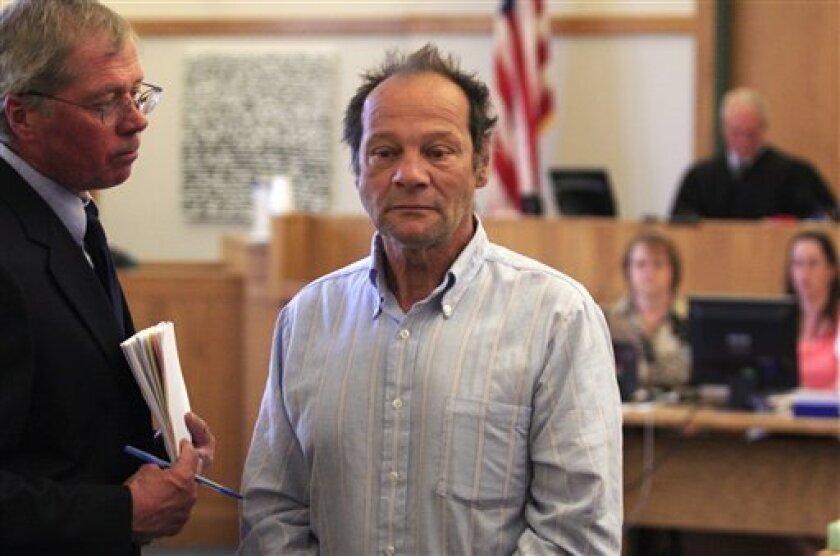 Douglas Gardner, 54, of Highgate, Vt., center, who recently finished a 20-year sentence for DUI with Death Resulting, is brought into Franklin County District Court, Monday, May 17, 2010, to face new charges, a month after his release, including DUI and driving with a suspended license after he crashed a car around midnight Saturday. (AP Photo/Alden Pellett)