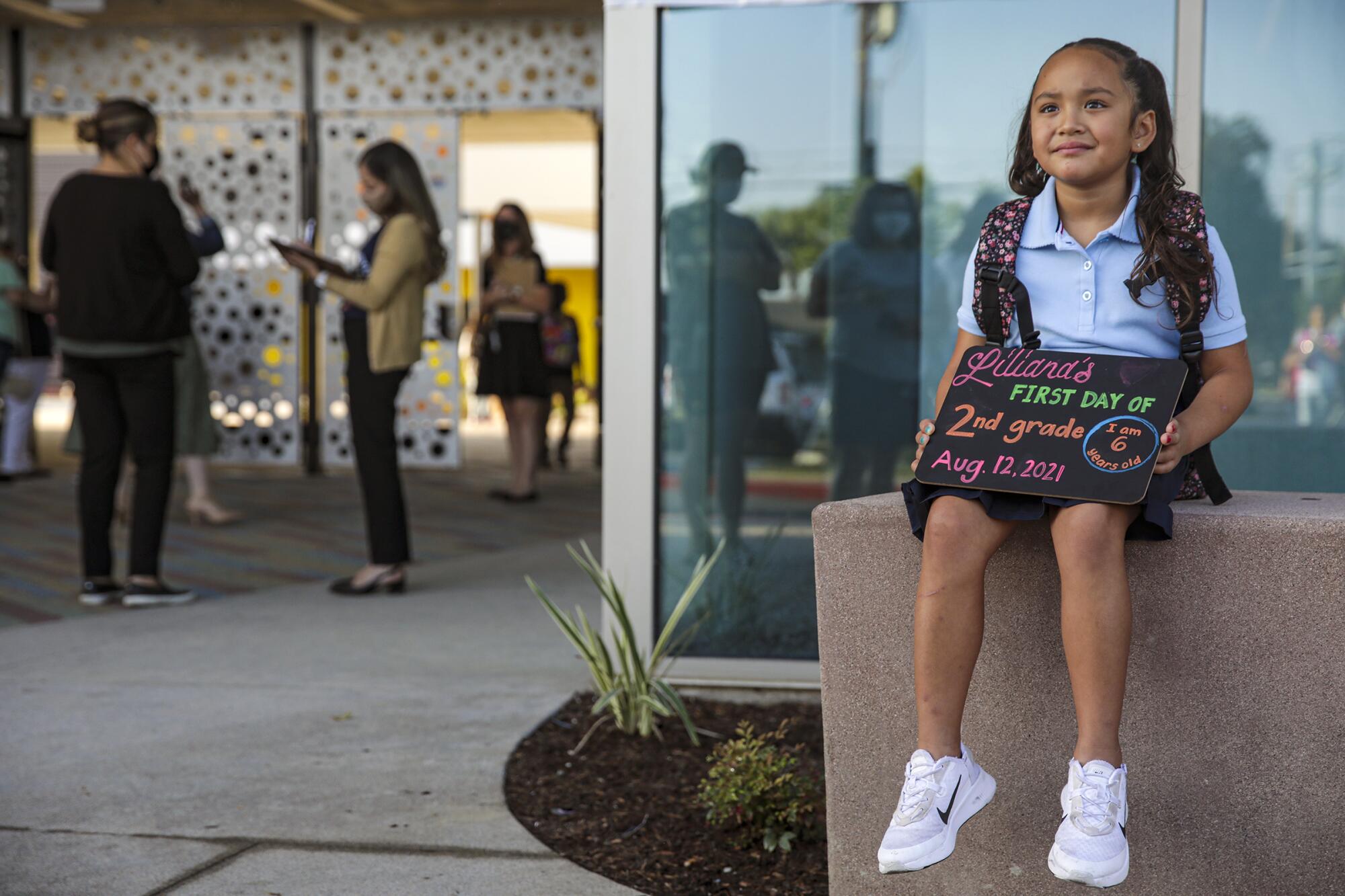 Liliana Sandoval poses for her first day of school photo 