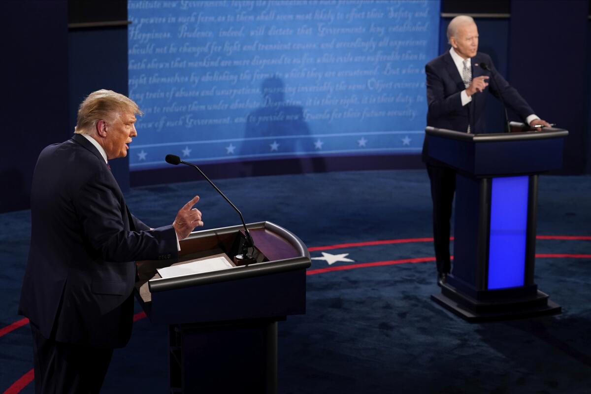 Then-President Trump and Democratic nominee Joe Biden participate in their first debate on Sept. 29, 2020.