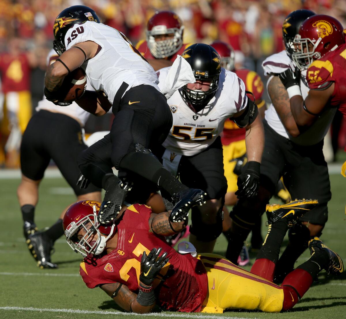 USC defensive back Su'a Cravens brings down Sun Devils quarterback Mike Bercovici during a game at the Coliseum on Oct. 4.