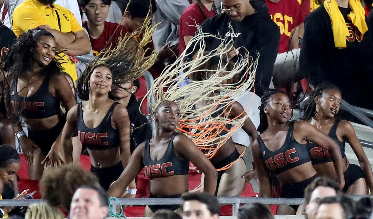 The Cardinal Divas perform in the stands during the USC versus Arizona State game.