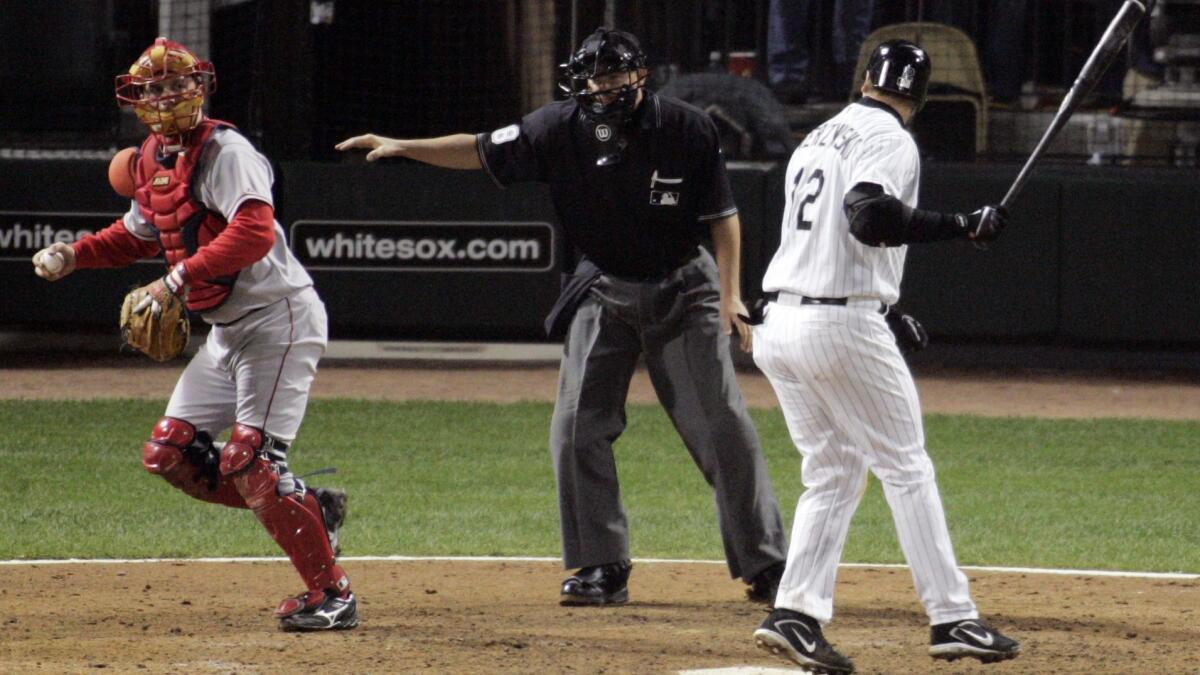 Then-Angels catcher Josh Paul, left, was part of an infamous play involving the Chicago White Sox's A.J. Pierzynski, right, and home plate umpire Doug Eddings during the 2005 American League Championship Series.