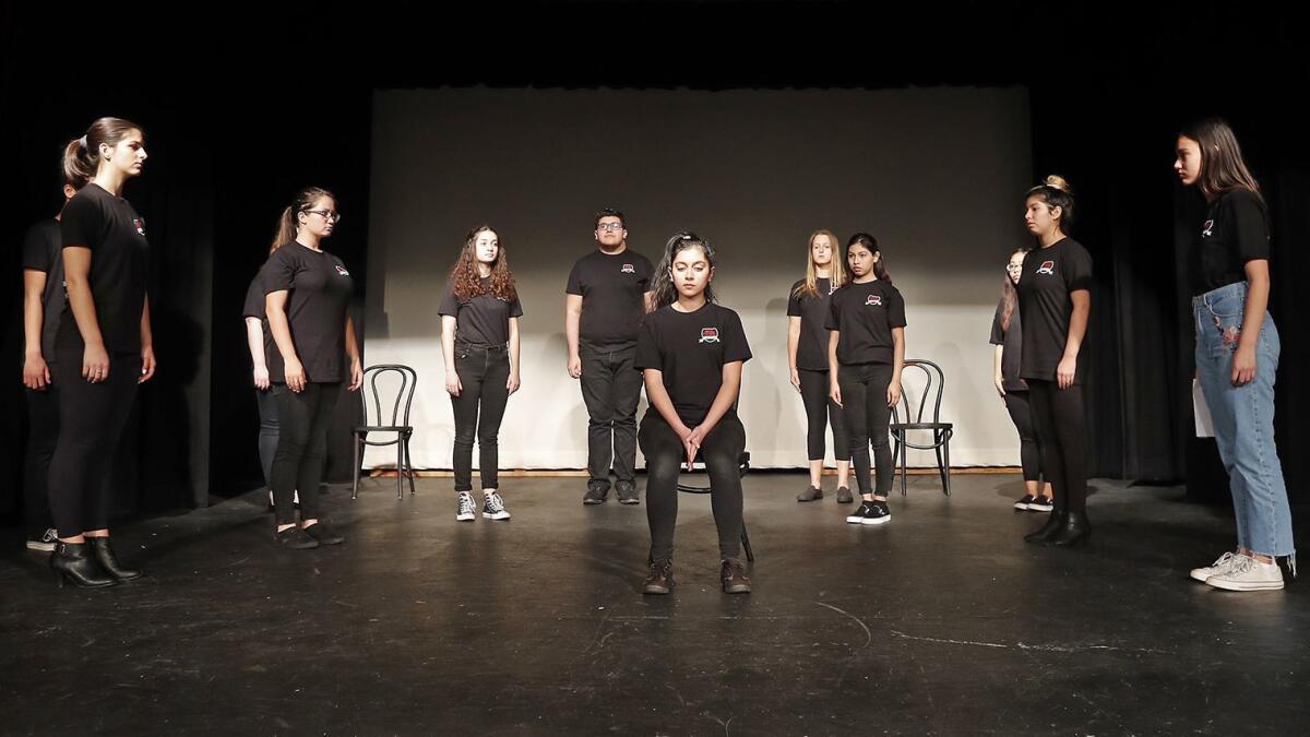 Drama students at Estancia High School in Costa Mesa rehearse a scene from “To Whom It May Concern,” an original play that they will perform Thursday through Saturday.
