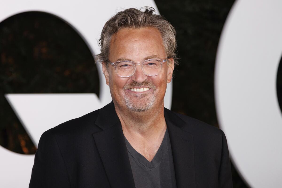 Matthew Perry smiles for the cameras. 