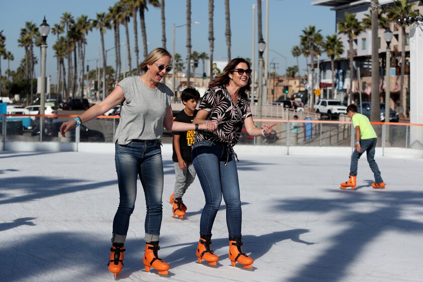 Huntington Beach Mayor Kim Carr, center, and Councilwoman Natalie Moser.