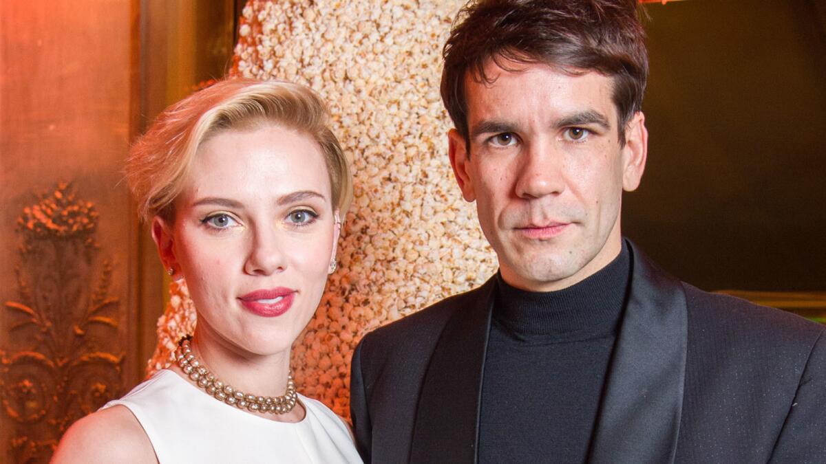 Scarlett Johansson and Romain Dauriac in December at the grand opening of Yummy Pop, their gourmet popcorn store in Paris.