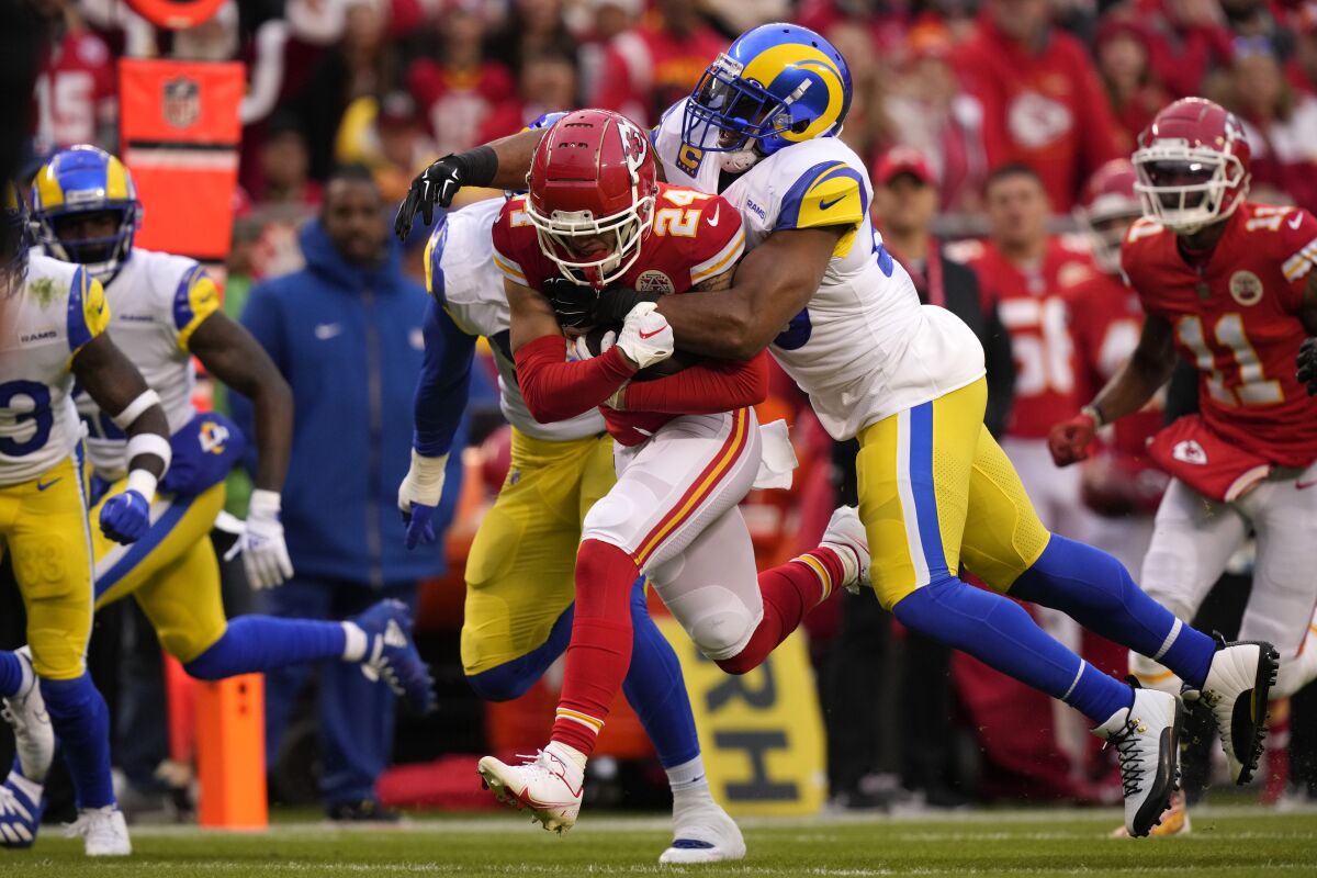 Kansas City Chiefs wide receiver Skyy Moore (24) is tackled by Los Angeles Rams linebacker Bobby Wagner (45) during the first half of an NFL football game Sunday, Nov. 27, 2022, in Kansas City, Mo. (AP Photo/Charlie Riedel)