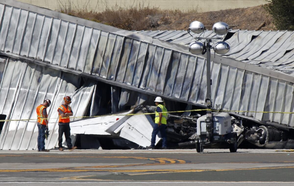 Investigators were awaiting the arrival Monday of a crane at Santa Monica Municipal Airport where a private jet crashed into a hangar after landing on Sunday.