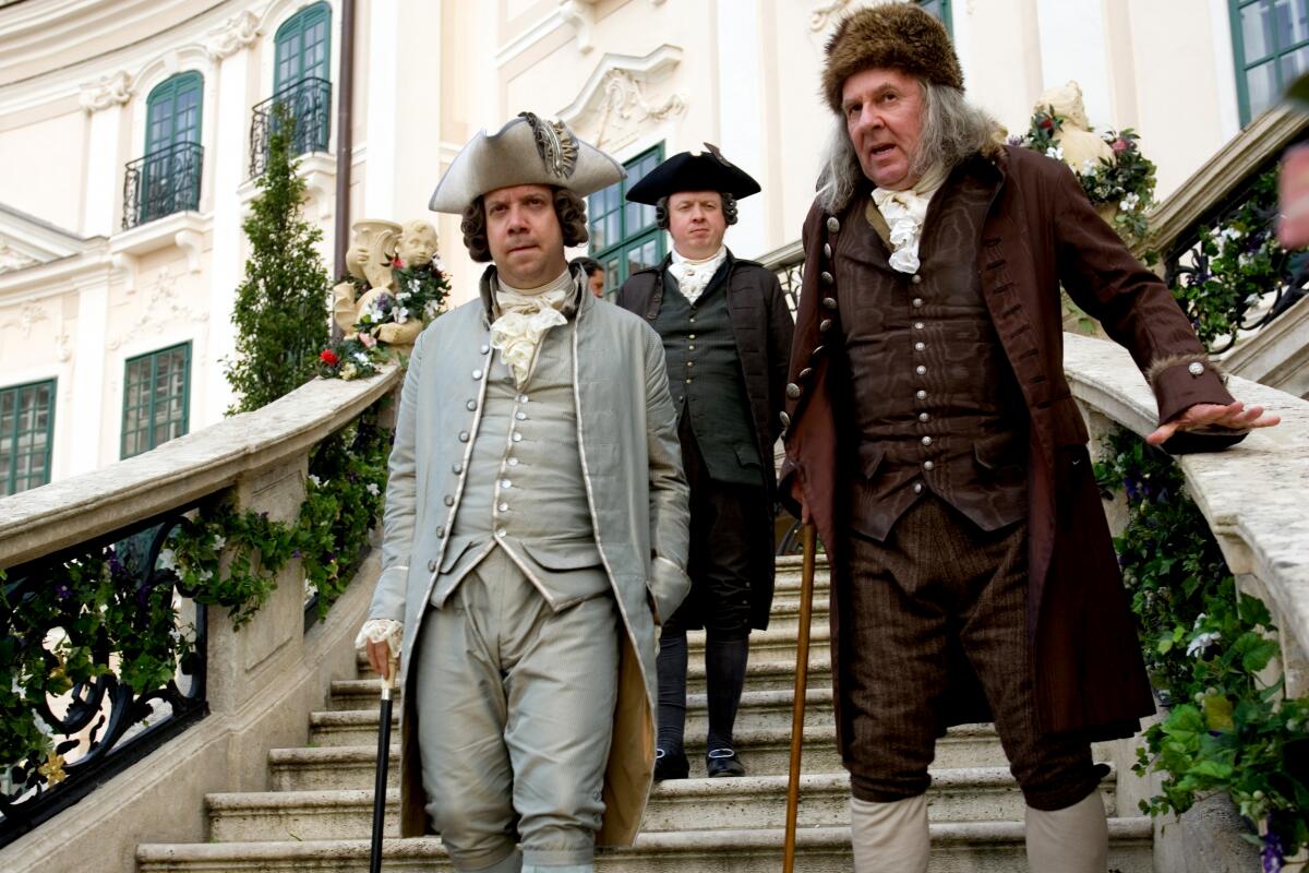 Paul Giamatti as John Adams and Tom Wilkinson as Benjamin Franklin walk down the stairs in "John Adams."