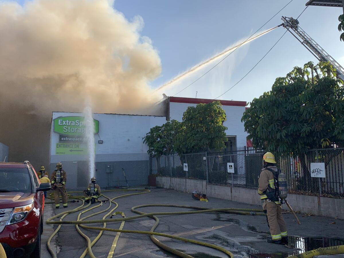 Firefighters battle a fire in Bellflower