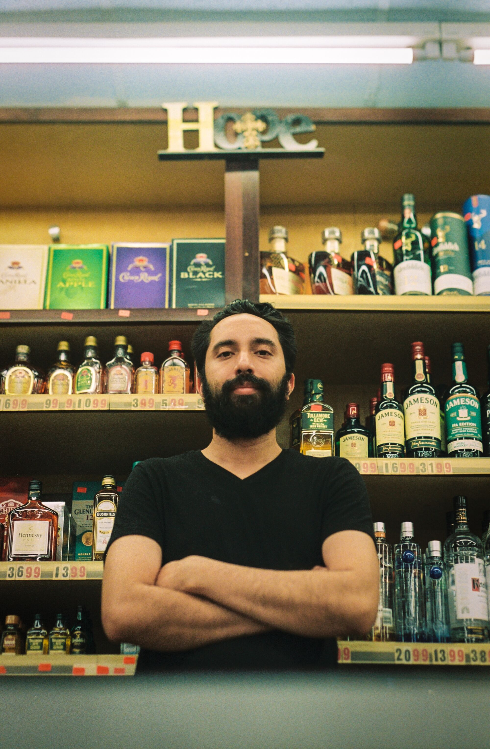 Rubal Singh, the face of Hope's Liquor, stands behind the counter.