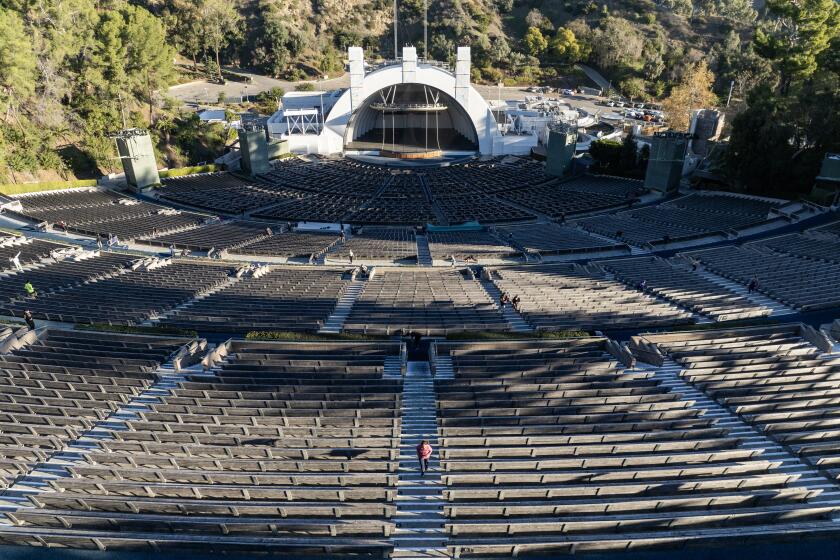 LOS ANGELES, - JANUARY 13: Saturday Stairs runners work out on the stairs at the Hollywood Bowl on Saturday, Jan. 13, 2024. (Myung J. Chun / Los Angeles Times)