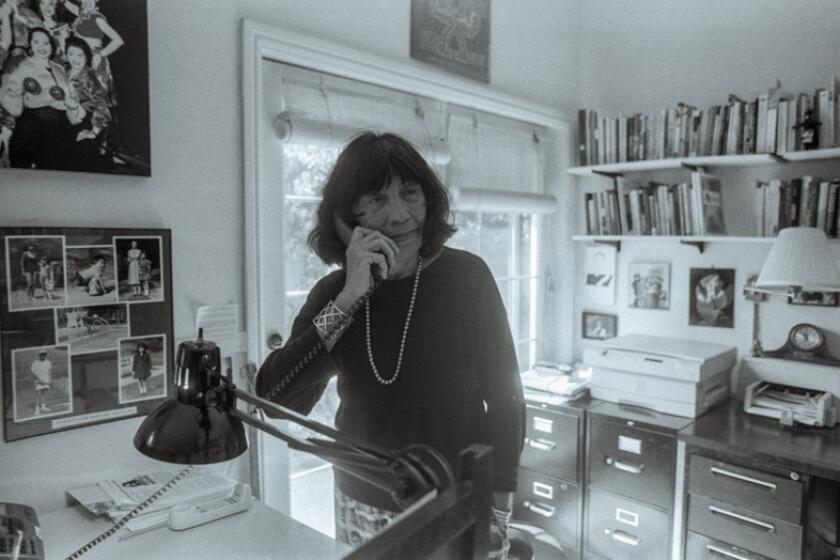 Elizabeth 'Betita' Martinez stands in her home office San Francisco in 2002.