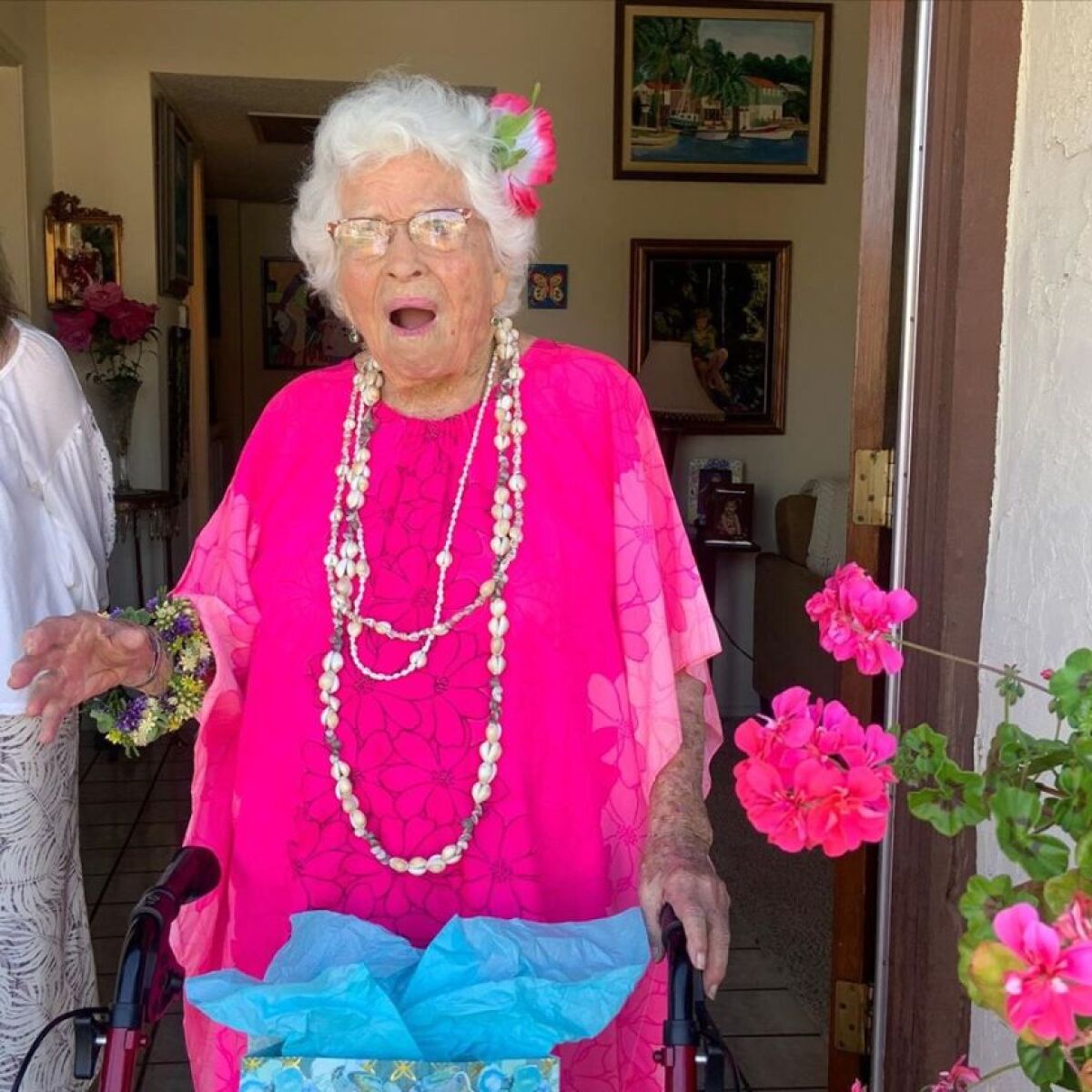 Christinia Lee gets a surprise hula dance and drive-by party for her 102nd birthday.