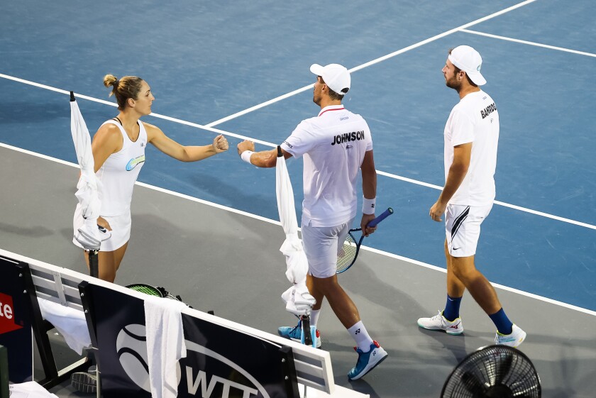 Gaby Dabrowski of the Orange County Breakers, left, encourages teammates Steve Johnson and Luke Bambridge.