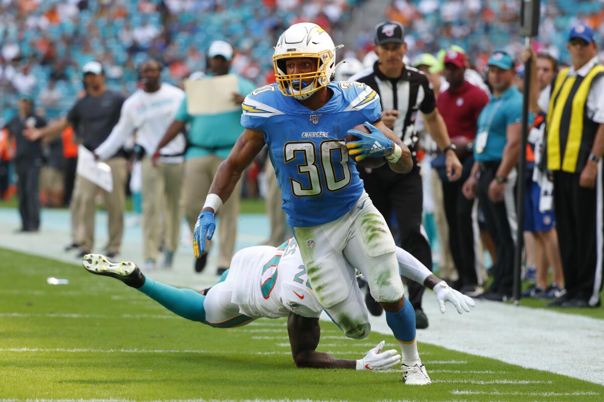 Chargers running back Austin Ekeler runs for a touchdown against the Miami Dolphins on Sept. 29.