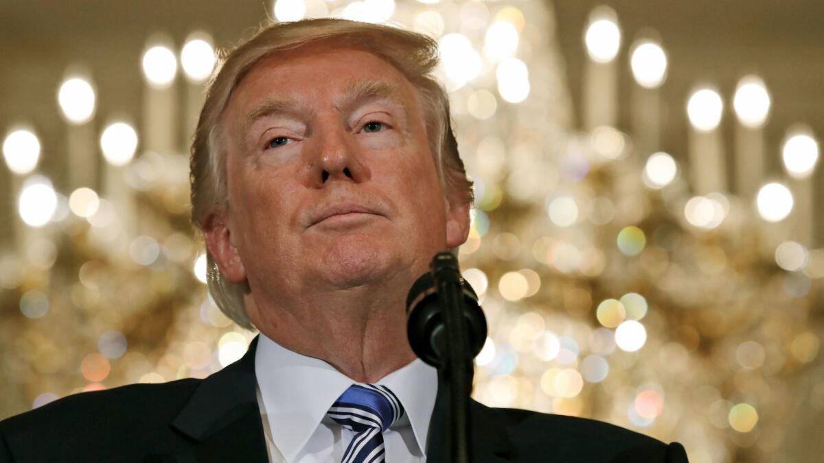 President Donald Trump pauses while speaking Monday during a "Made in America" product showcase at the White House featuring items created in each of the 50 states. (AP Photo/Alex Brandon)