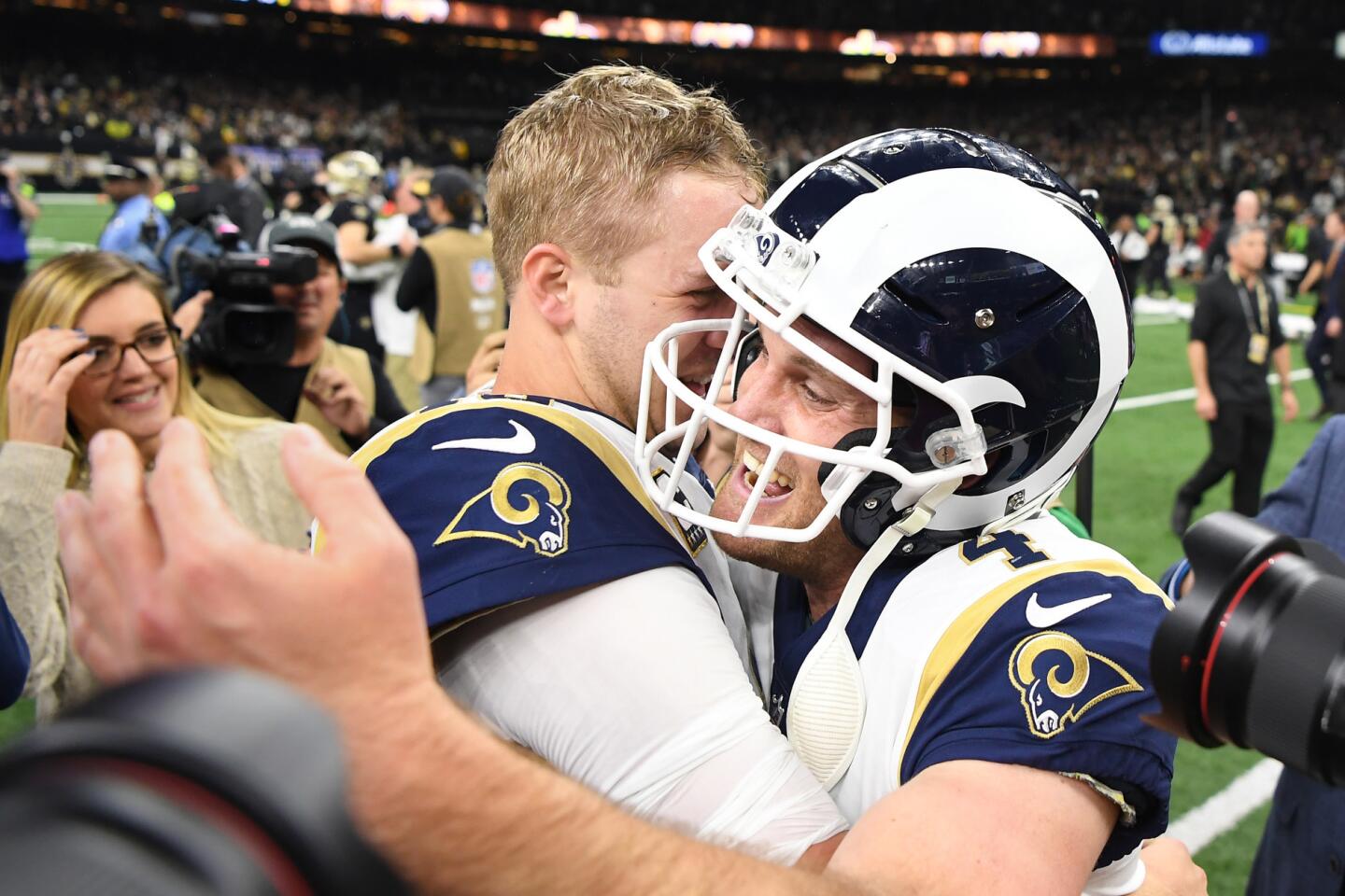 Rams quarterback Jared Goff hugs kicker Greg Zuerlein after defeating the New Orleans Saints in overtime on a field goal in the NFC Championship at the Superdome in New Orleans Sunday.