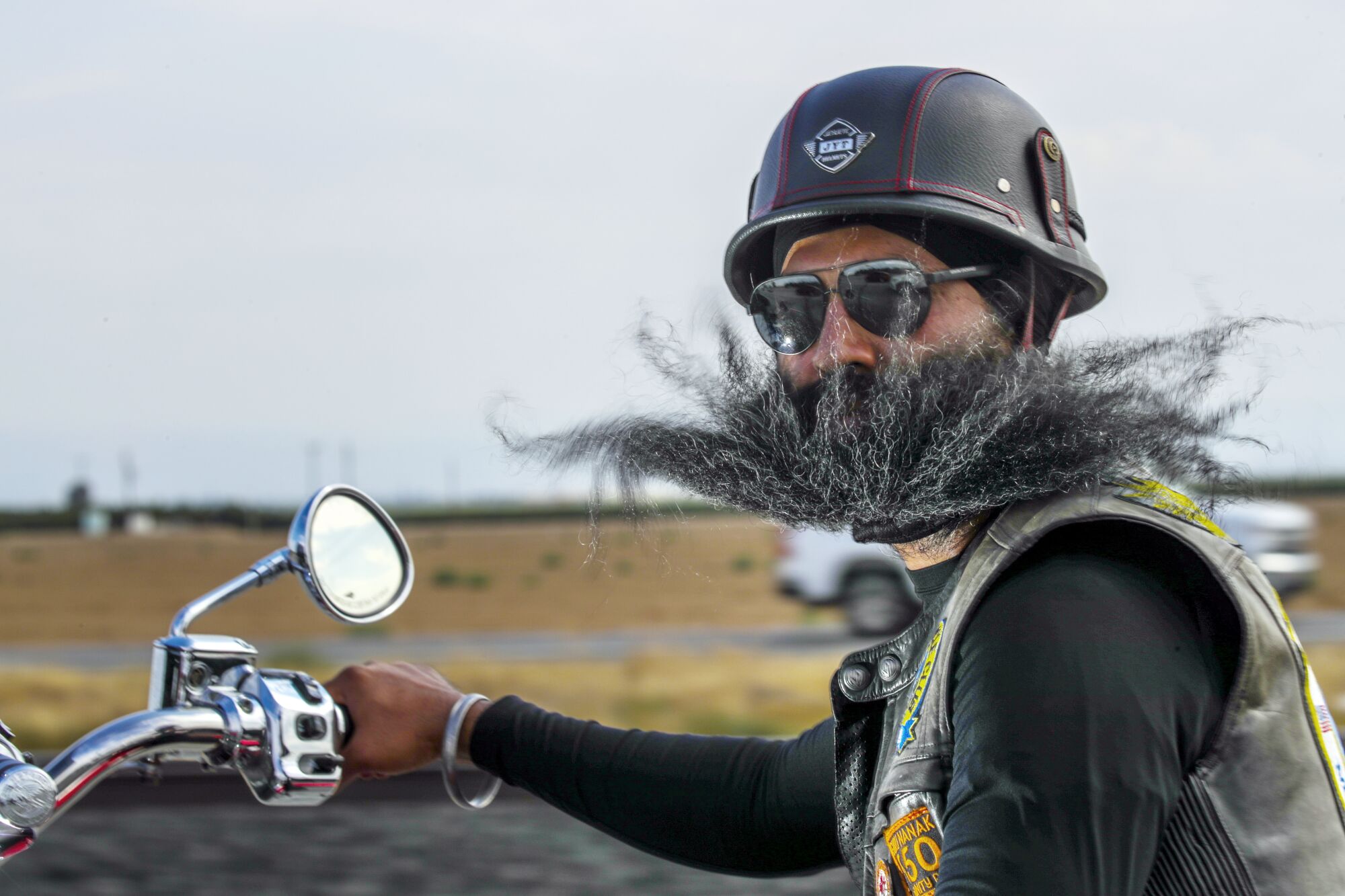 Satnam Singh, secretary of Sikh Motorcycle Club USA, riding on Highway 99 in Bakersfield.