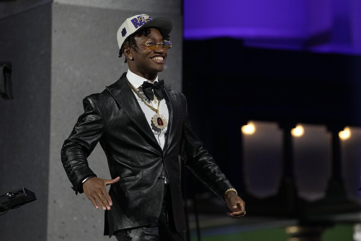 Boston College wide receiver Zay Flowers walks onto the stage after he was drafted by the Baltimore Ravens.