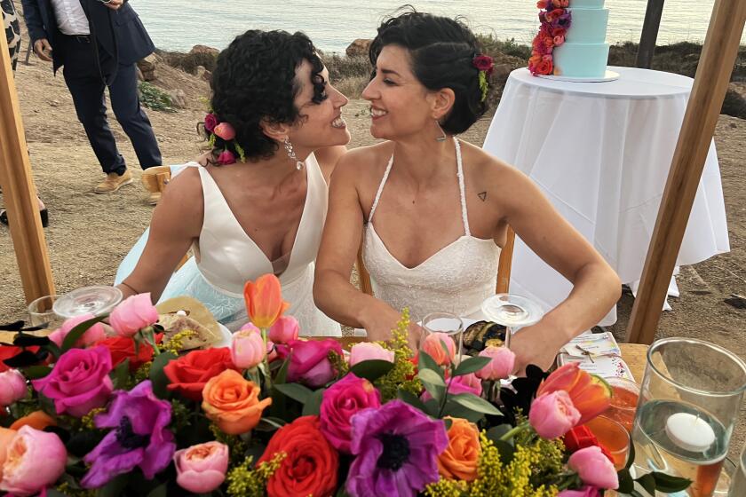 Playas de Rosarito, Baja California-Aug. 4, 2023-Julia Markish, left, and Krissa Lagos, at their wedding in Baja California on Aug. 4, 2023. (Robin Abcarian / Los Angeles Times)