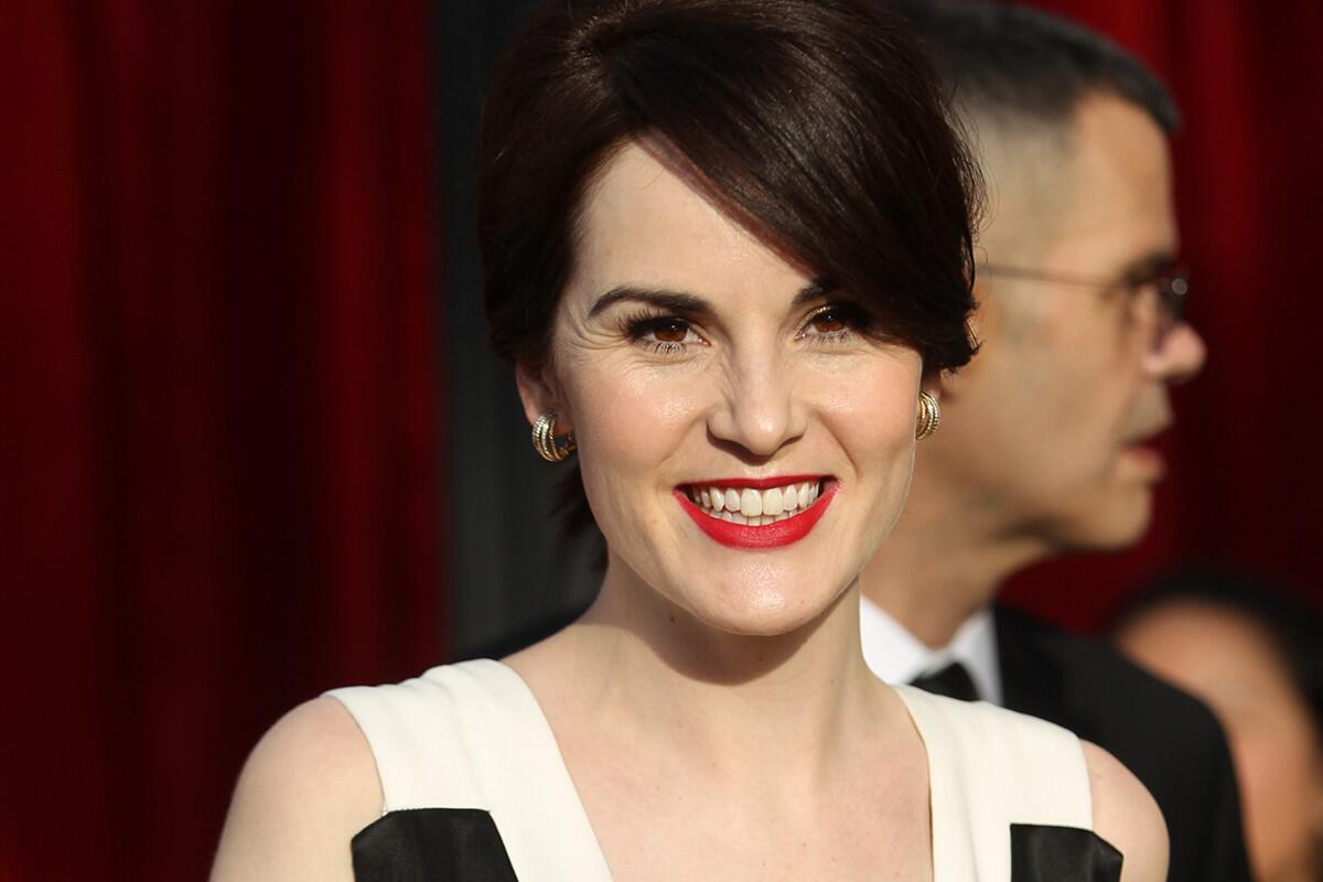 Michelle Dockery of "Downton Abbey" arrives for the 20th Annual Screen Actors Guild Awards at the Shrine Exposition Center in Los Angeles on Saturday.