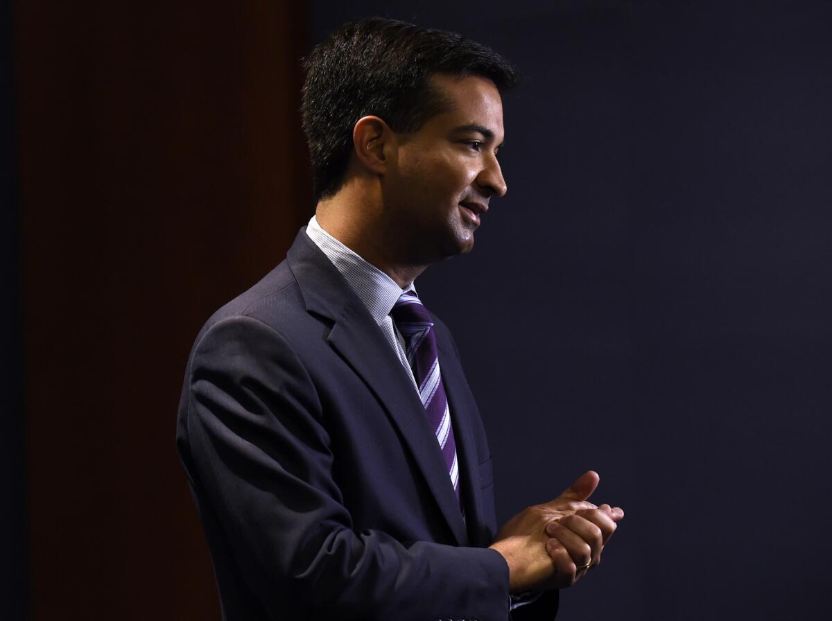 Florida Rep. Carlos Curbelo, shown in November 2014, delivered the Spanish-language Republican response to President Obama's State of the Union address Tuesday night. His response mentioned immigration, a topic that Iowa Sen. Joni Ernst, who delivered the English-language response, left out.